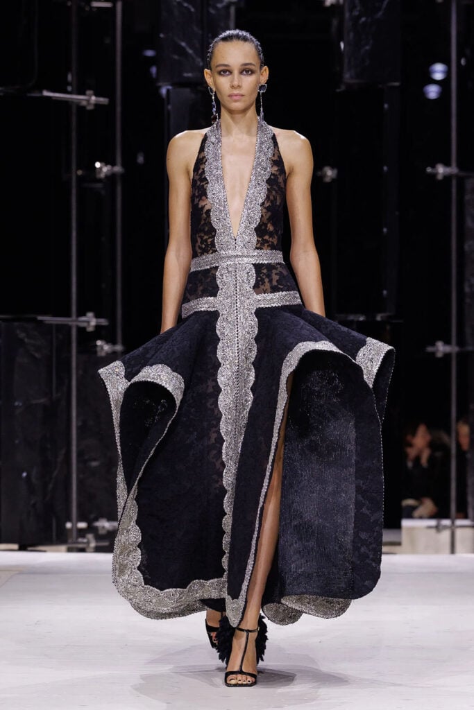 Givenchy black-and-silver lace dress from the Spring 2026 collection on the runway.