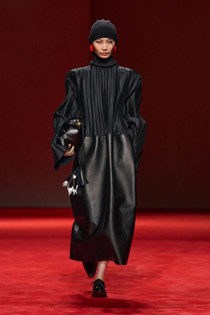 Bottega Veneta Fall 2026 satin plissé and leather dress on the runway.