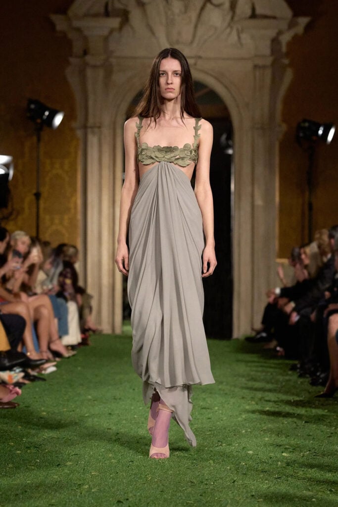 Valentino Fall 2026 draped grey gown with floral bodice on the runway.