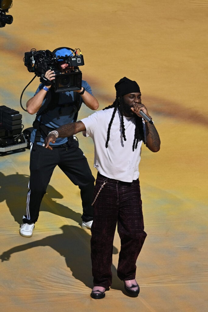 Shakira performs alongside Burna Boy and dancers wearing custom Roberto Cavalli during the FIFA World Cup Final halftime show.