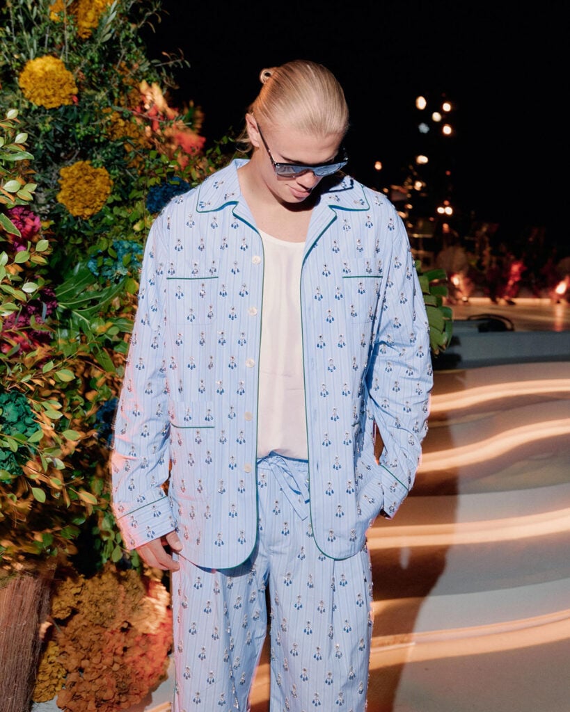 Erling Haaland wearing a blue embroidered Dolce & Gabbana pyjama-inspired look during his summer holiday.