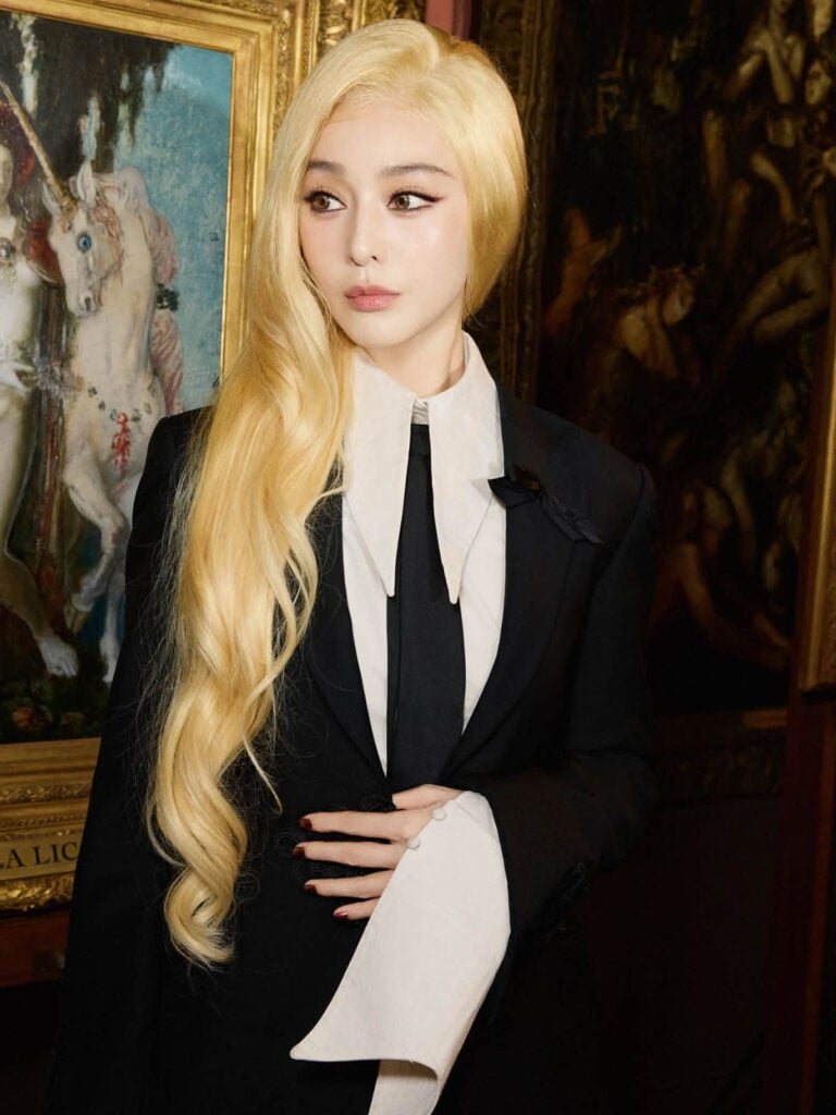 Close-up of Fan Bingbing in Luke Azzopardi Couture tailoring with platinum-blonde hair and black tie.