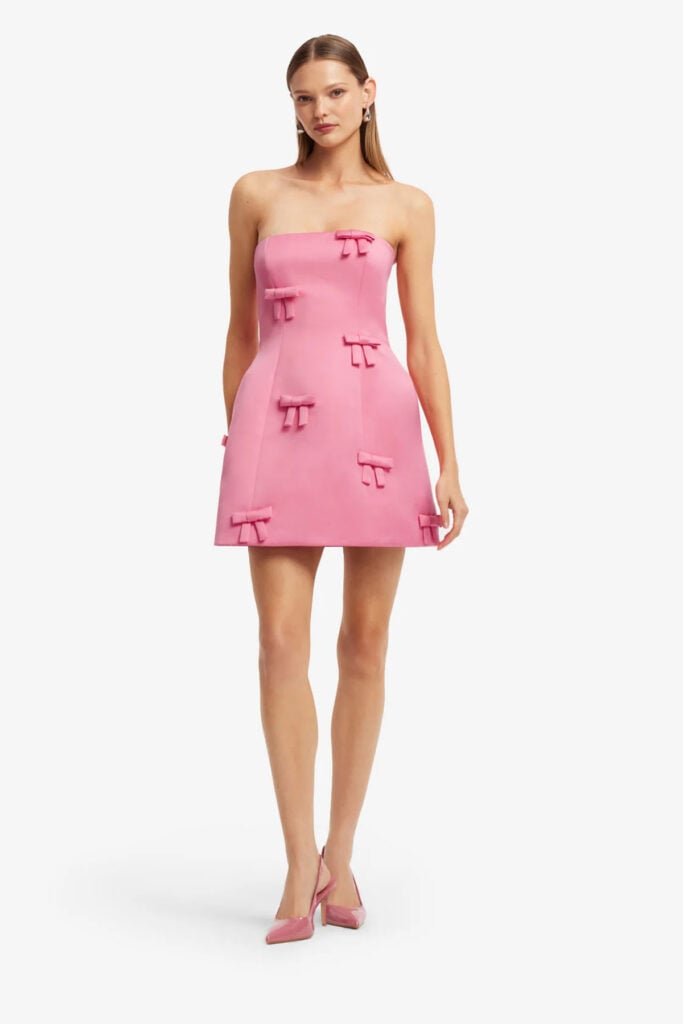 Leo Lin Roselle strapless pink mini dress with bow embellishments from the designer's collection.