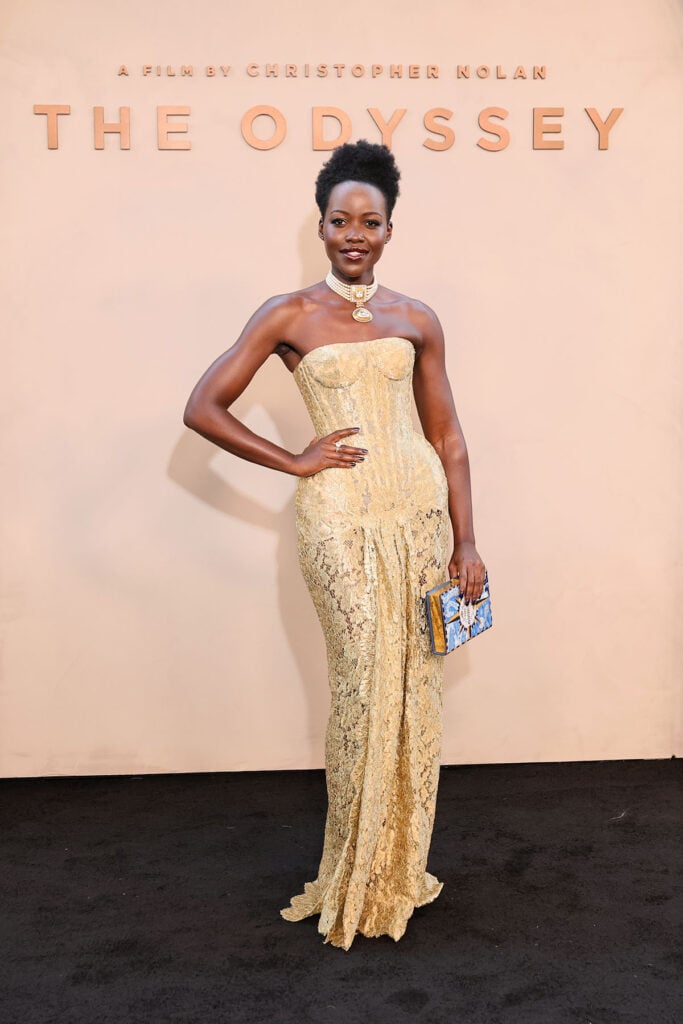 Lupita Nyong'o carries an Olympia Le-Tan The Odyssey clutch with her Nicholas Oakwell Couture gown at the New York premiere.