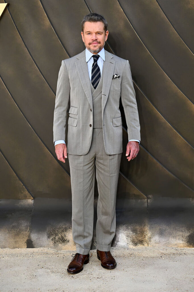Matt Damon wearing a light-grey dunhill three-piece suit at The Odyssey world premiere in London.