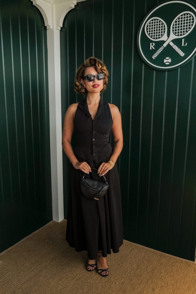 Raye attending the Wimbledon 2026 men's final in a black halter dress.