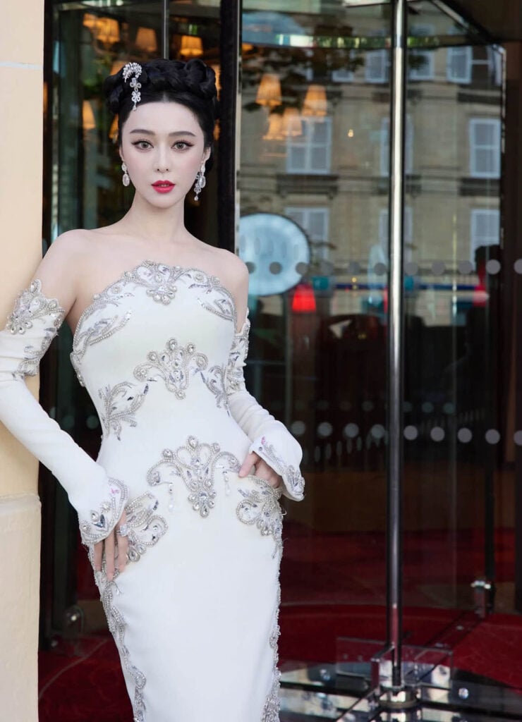 Close-up of Fan Bingbing in Georges Hobeika Fall 2026 Couture with sculptural updo and silver jewellery in Paris.
