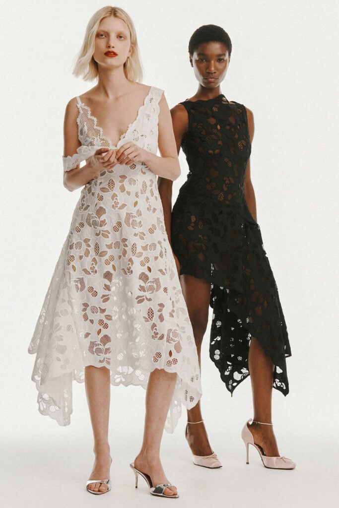 Monse Pre-Fall 2026 white eyelet lace midi dress with an asymmetric handkerchief hem from the runway collection.