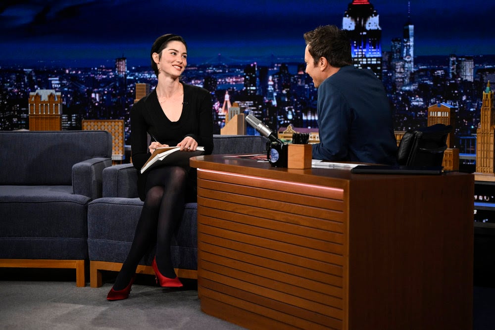 Gracie Abrams wears a vintage black Alaïa dress while appearing on The Tonight Show Starring Jimmy Fallon.