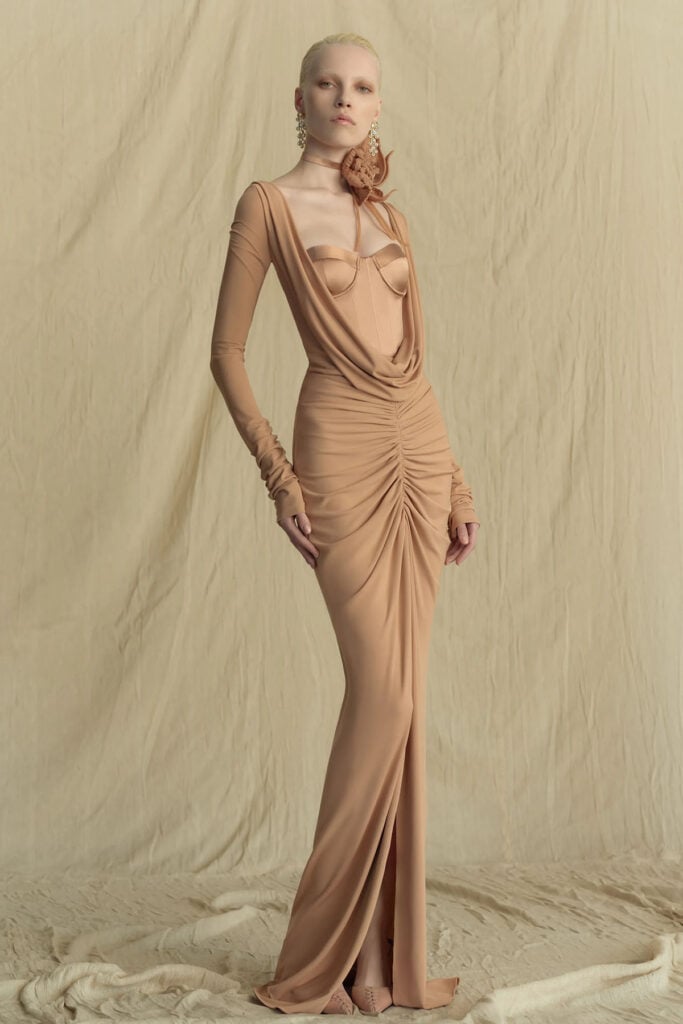 Zuhair Murad Fall 2026 blush pink gown featuring a corseted satin bustier and sculptural draping on the runway.