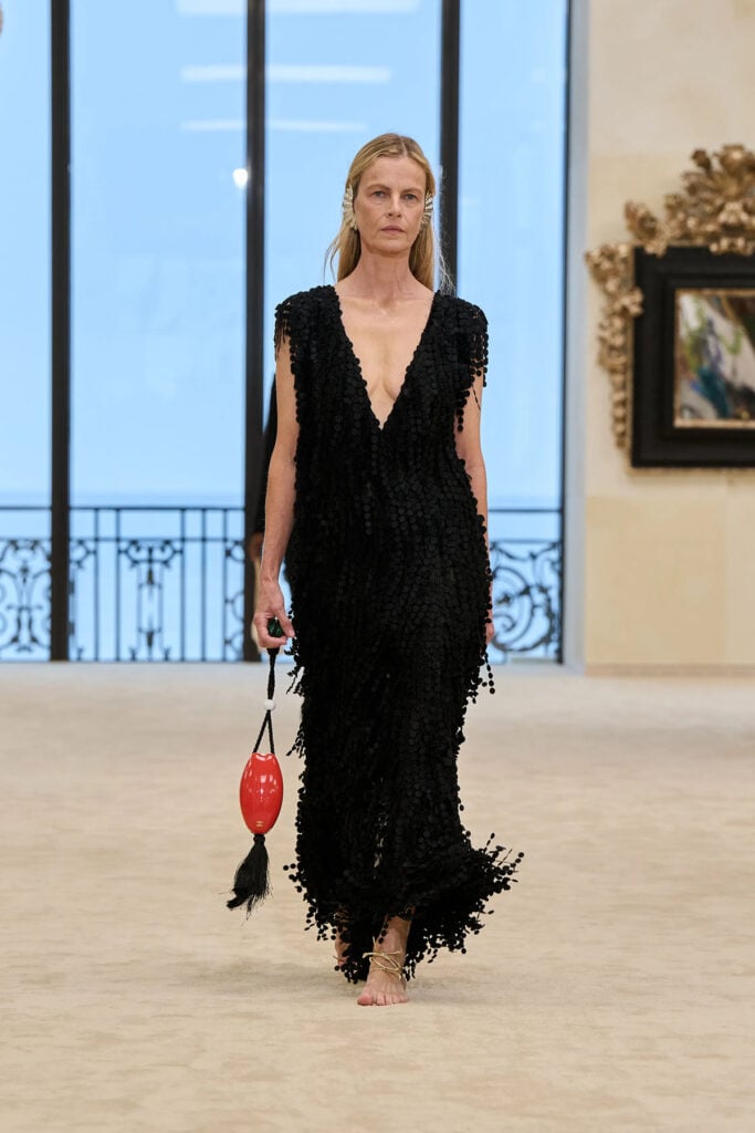 Chanel Resort 2027 runway model wearing the black paillette dress with soleless sandals.