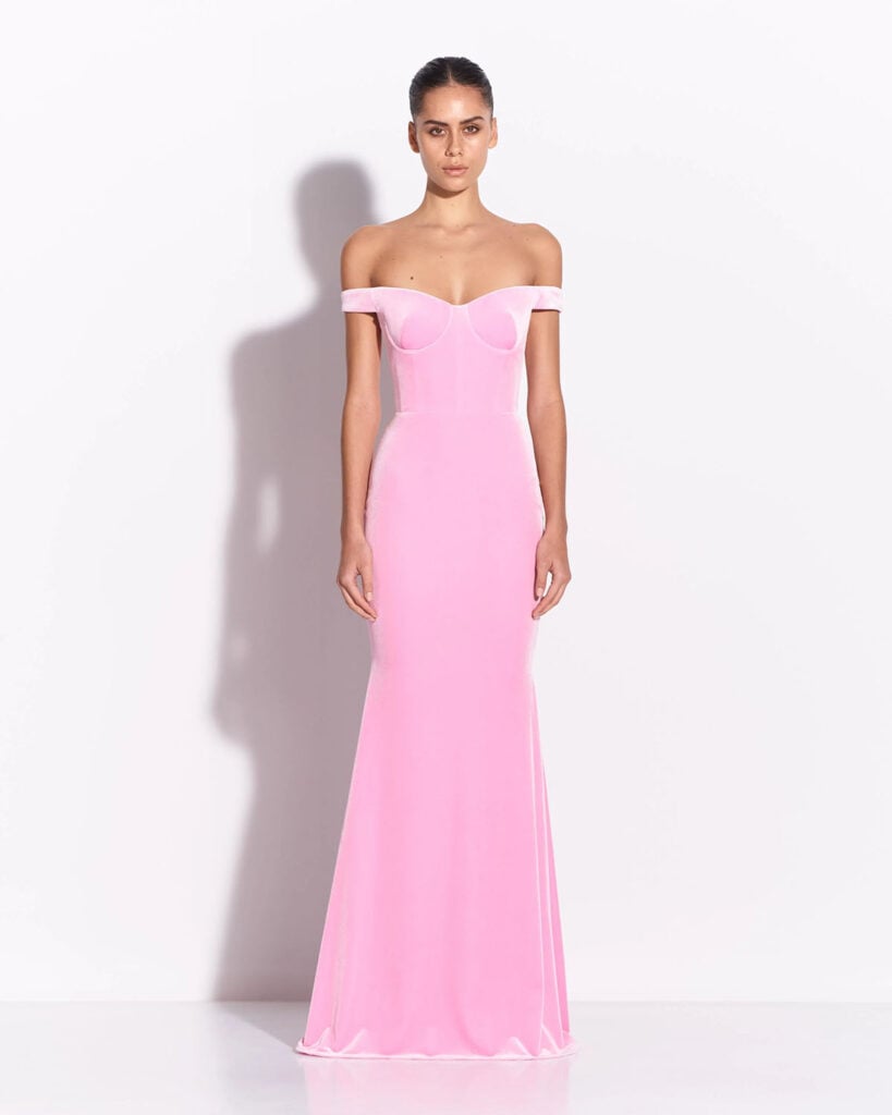 Alex Perry pink velvet off-the-shoulder gown featuring a sculpted bodice and floor-length silhouette.