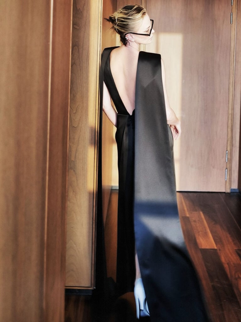 Charlize Theron open-back detail of her black Celine ensemble at the 'The Odyssey' Seoul premiere.