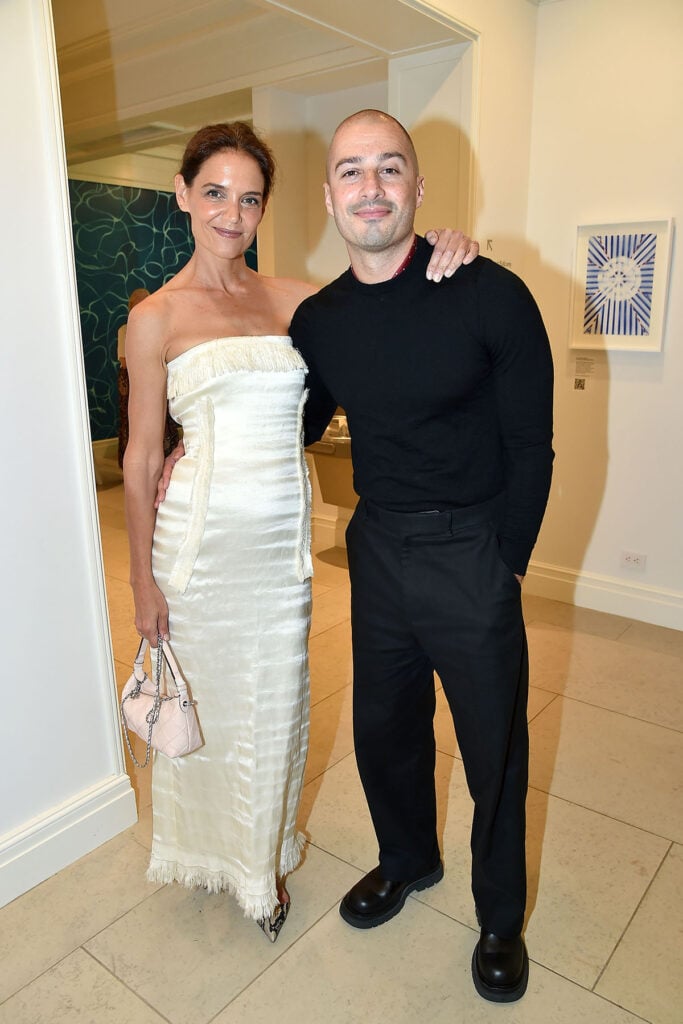 Katie Holmes wears an ivory Fforme dress with snakeskin pumps at the 2026 Guild Hall Summer Gala in East Hampton.