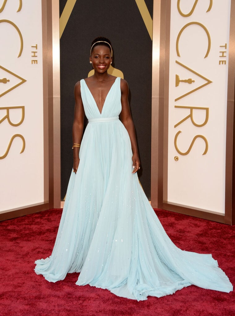 Lupita Nyong'o attends the Oscars 2014 Prada blue gown