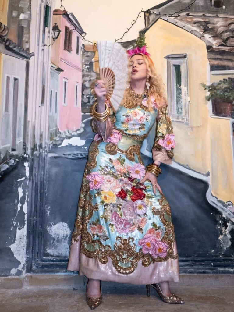 Madonna wears the Dolce & Gabbana Alta Moda Bartolomea dress with a floral headpiece during her birthday celebrations in Greece.
