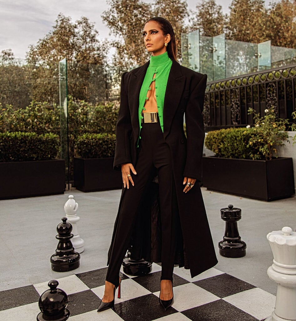 Poorna Jagannathan wears sculptural Mugler tailoring by Miguel Castro Freitas to the 'Lanterns' LA premiere at Paramount Theatre.
