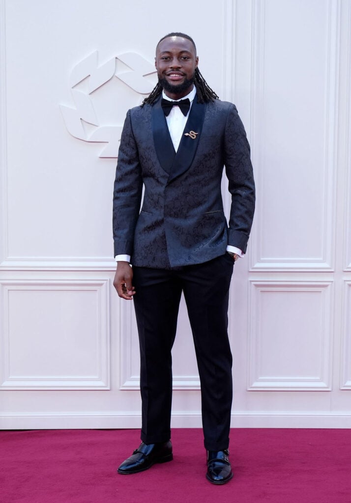 Antoine Semenyo wears a custom COTY suit by Justin Kunz with Bvlgari jewellery at the 2026 PFA Awards.