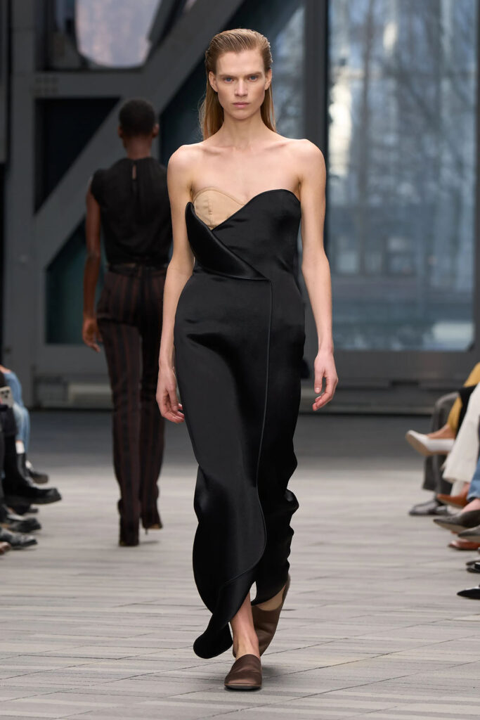 Black strapless Calvin Klein Collection dress with contrasting corset detail on the Fall 2026 runway