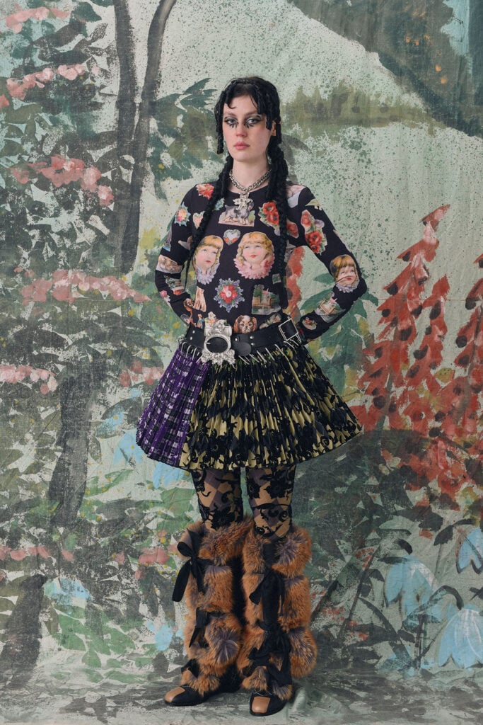 A model wears the Chopova Lowena Fall 2026 Turf mini carabiner skirt later worn by Maisie Williams during the Practical Magic 2 London press tour.