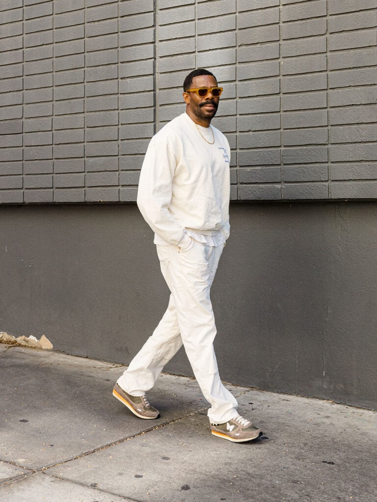 Colman Domingo wears a cream casual look with Valentino Garavani Stud Up sneakers while out in Los Angeles.