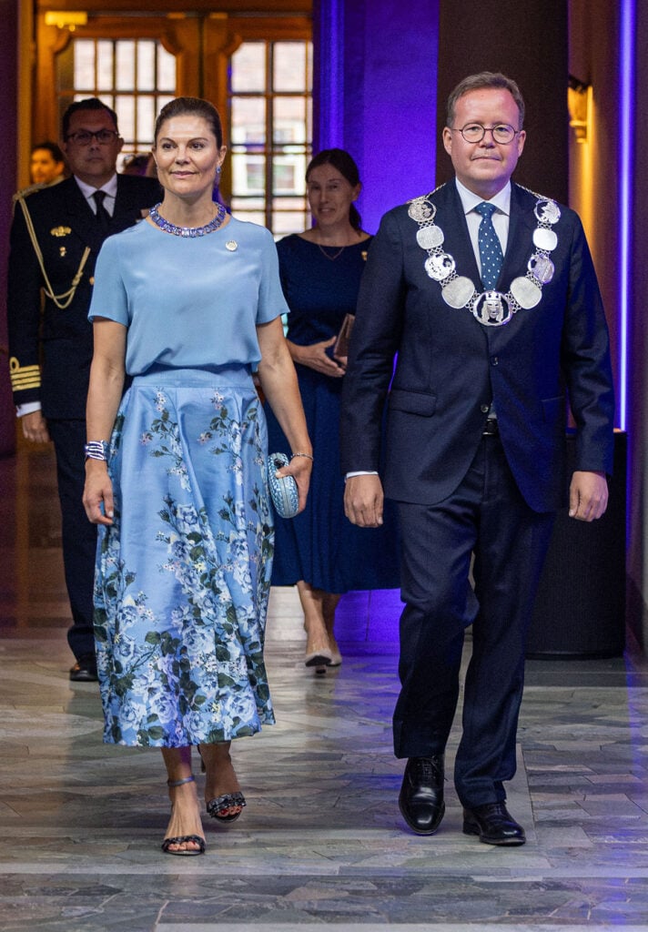 Crown Princess Victoria of Sweden wearing a blue byTiMo floral skirt at the Stockholm Junior Water Prize in Stockholm