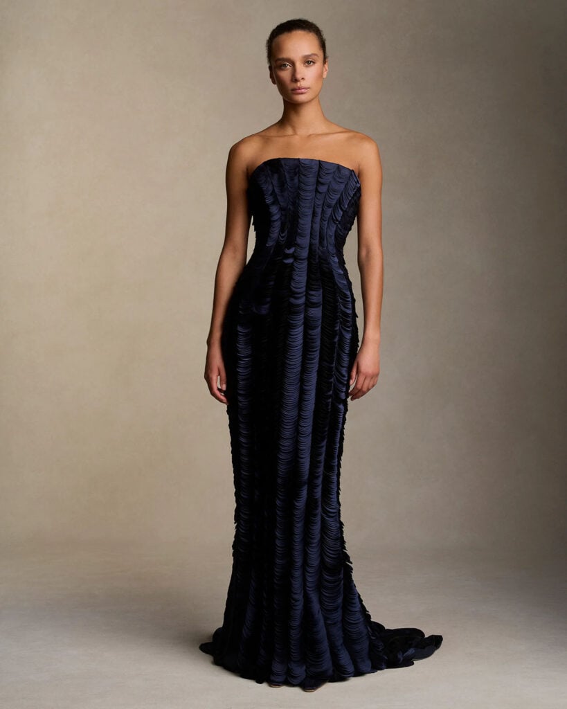 Danielle Frankel Lisbet gown featuring a strapless flared neckline and cascading laser-cut satin petals.