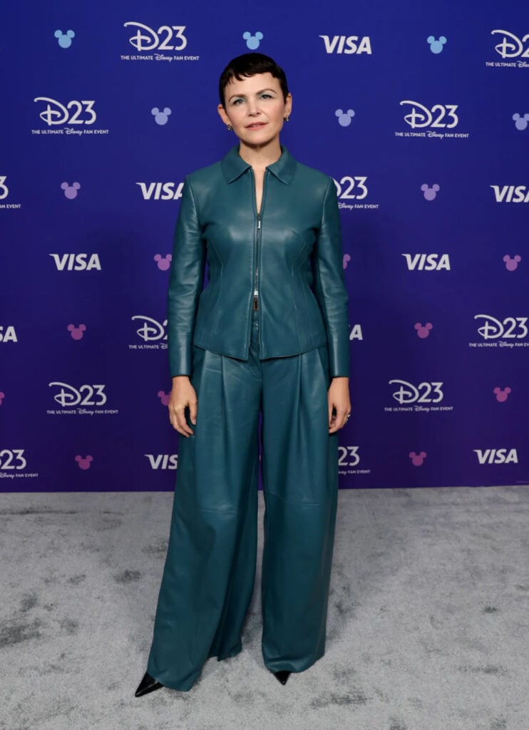 Ginnifer Goodwin wears a teal Akris leather suit at the D23 Expo 2026 in Anaheim for 'Zootopia 3'.