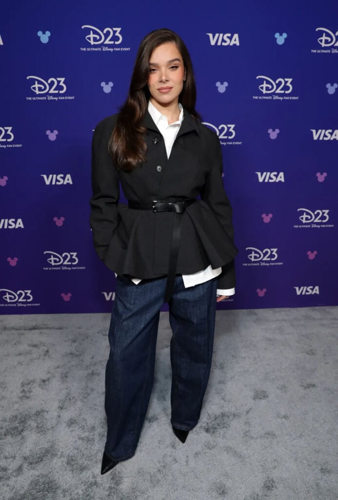 Hailee Steinfeld wears AMI Paris tailoring and wide-leg jeans at the D23 Expo 2026 in Anaheim for 'Hexed'.