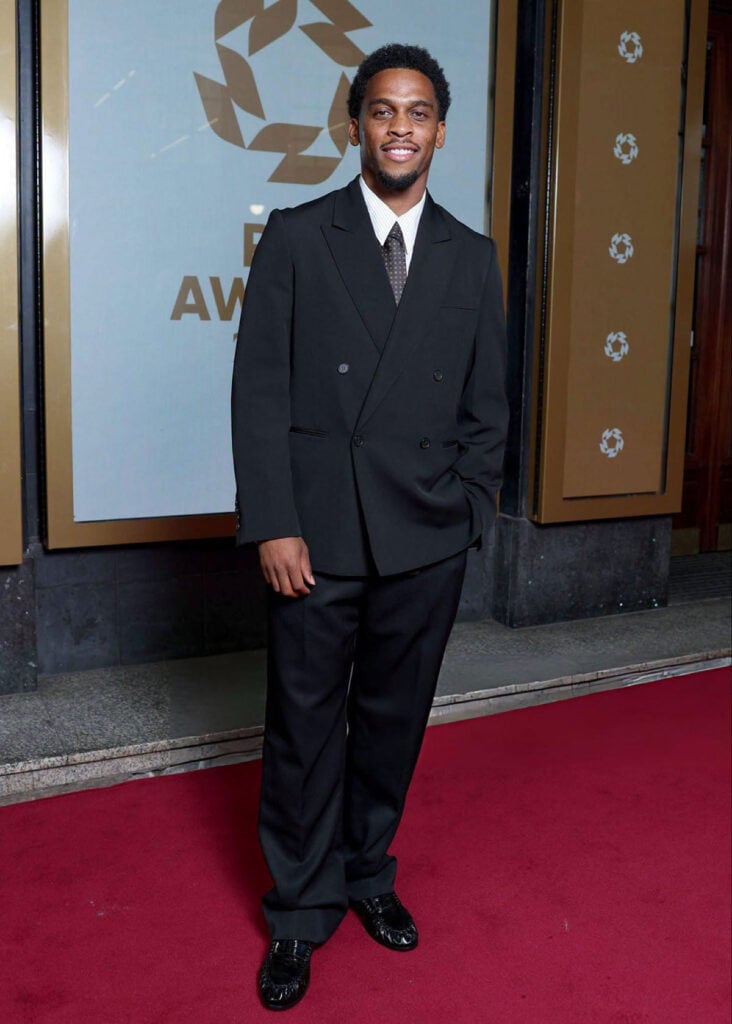 Jurrien Timber wears a black double-breasted suit at the 2026 PFA Awards in Manchester.