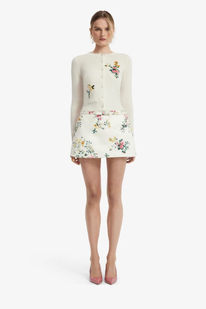 Leo Lin’s Nori mini skort in the Posy Print in Snow floral pattern from the Resort 2027 collection.