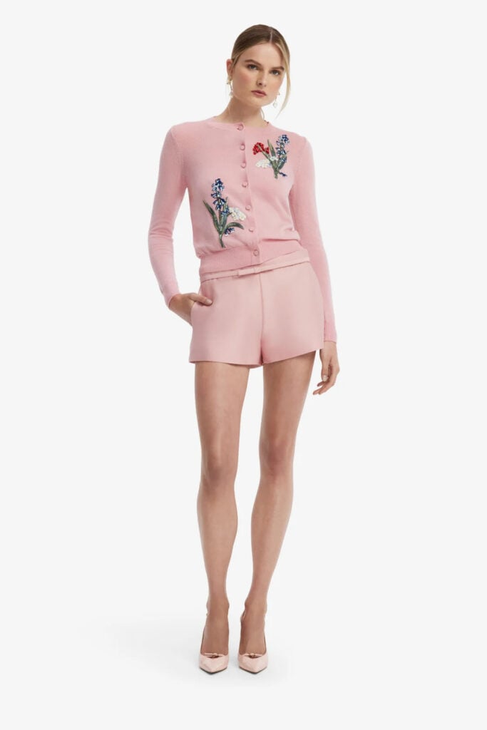 Leo Lin’s pink Claire embellished knit cardigan from the Resort 2027 collection, shown with matching pink shorts.