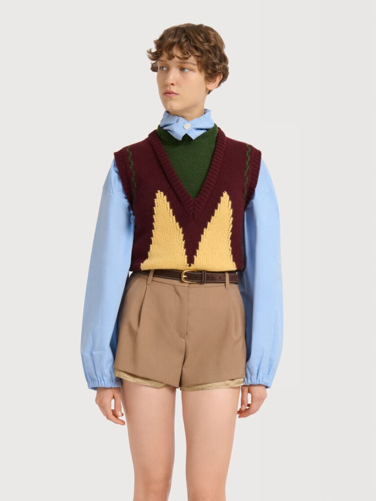 Marni burgundy knitted vest with yellow detailing layered over a green knit