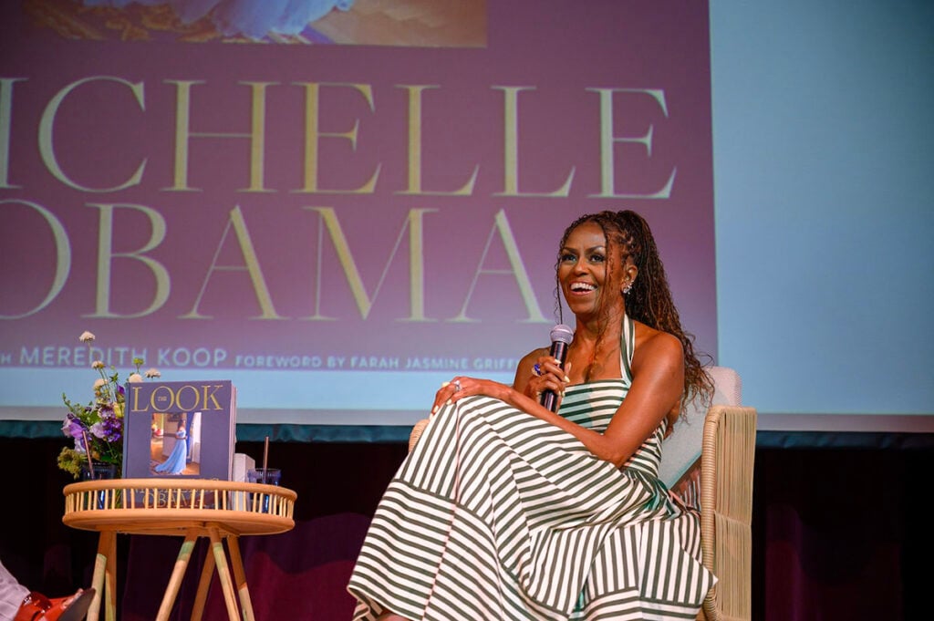 Michelle Obama discussing The Look at the Martha’s Vineyard Author Series in her Carolina Herrera striped dress