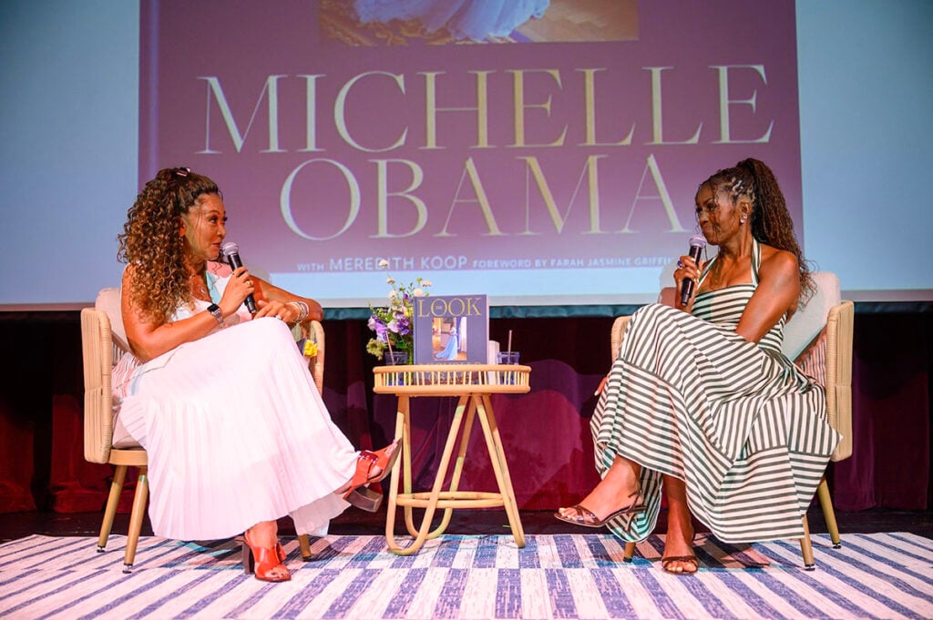 Michelle Obama wearing a striped Carolina Herrera halterneck dress at the Martha’s Vineyard Author Series