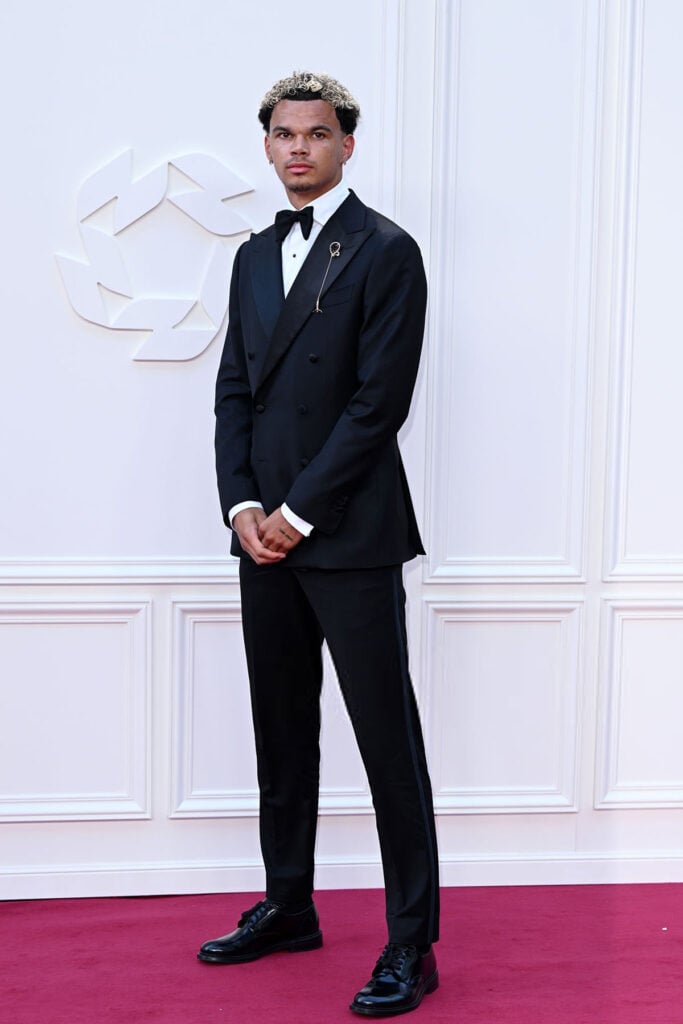 Nico O’Reilly wears a Clements and Church suit with a Gucci bow tie at the 2026 PFA Awards in Manchester.