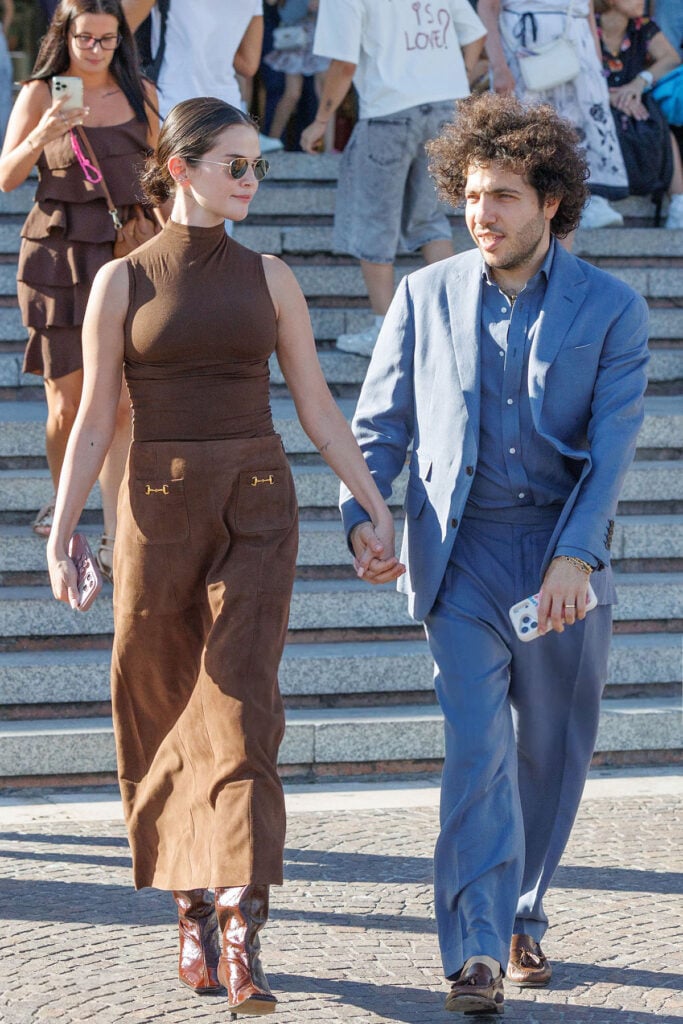 Selena Gomez wears a brown RIXO suede skirt and matching turtleneck while arriving in Venice.