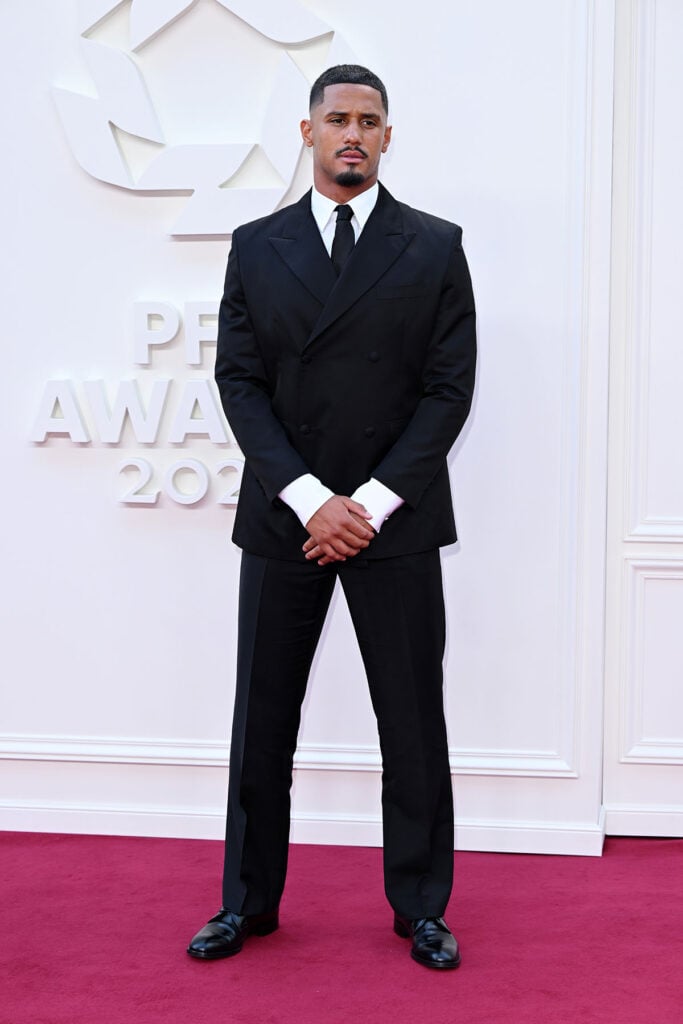 William Saliba rewears his black Prada suit for the 2026 PFA Awards in Manchester.