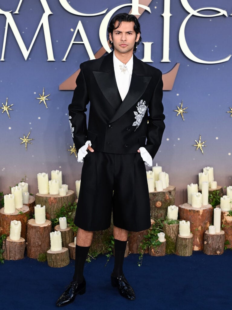 Xolo Maridueña wears a Viviano cropped floral blazer with tuxedo shorts at the Practical Magic 2 London premiere.