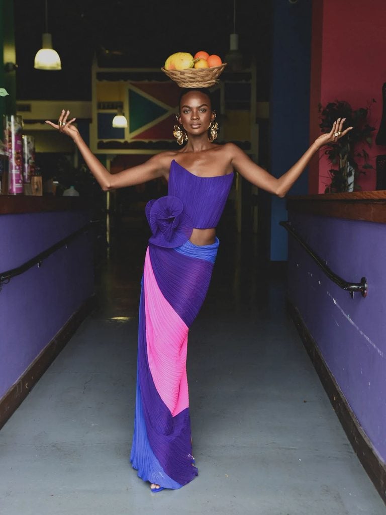 Atelier Ndigo purple, blue and hot-pink pleated design featuring sculptural detailing and asymmetric draping.