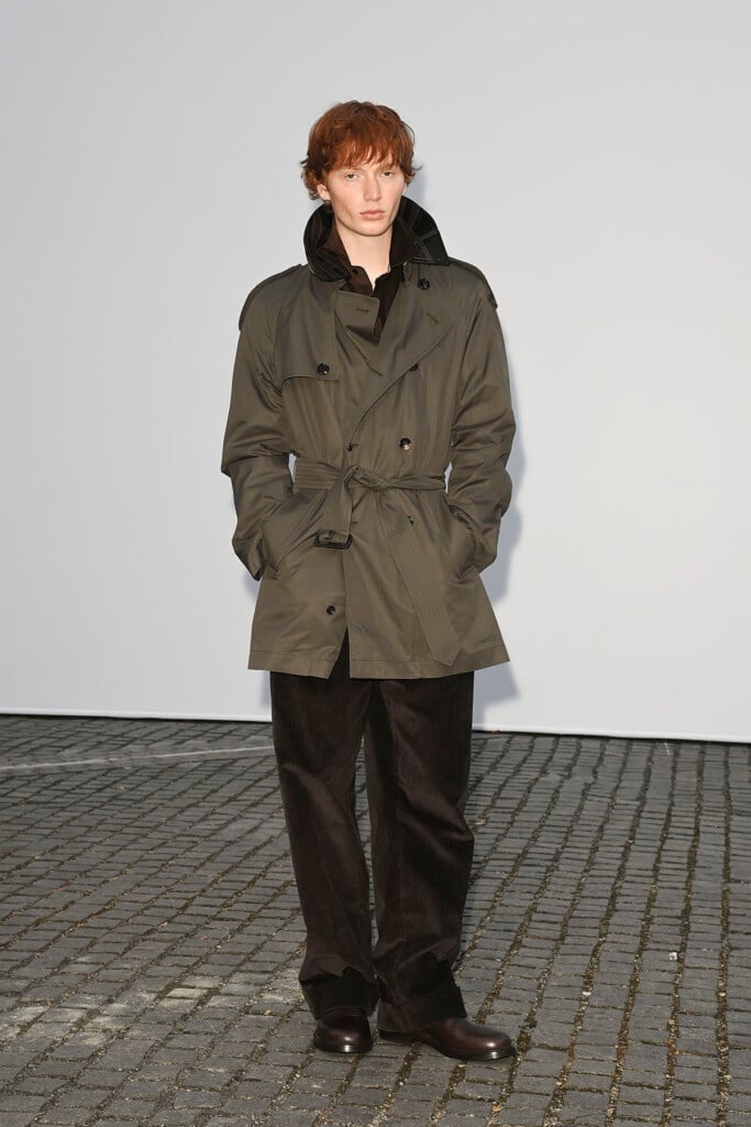 Calum Harper wearing an olive Burberry trench coat at the Burberry Summer 2027 show in London