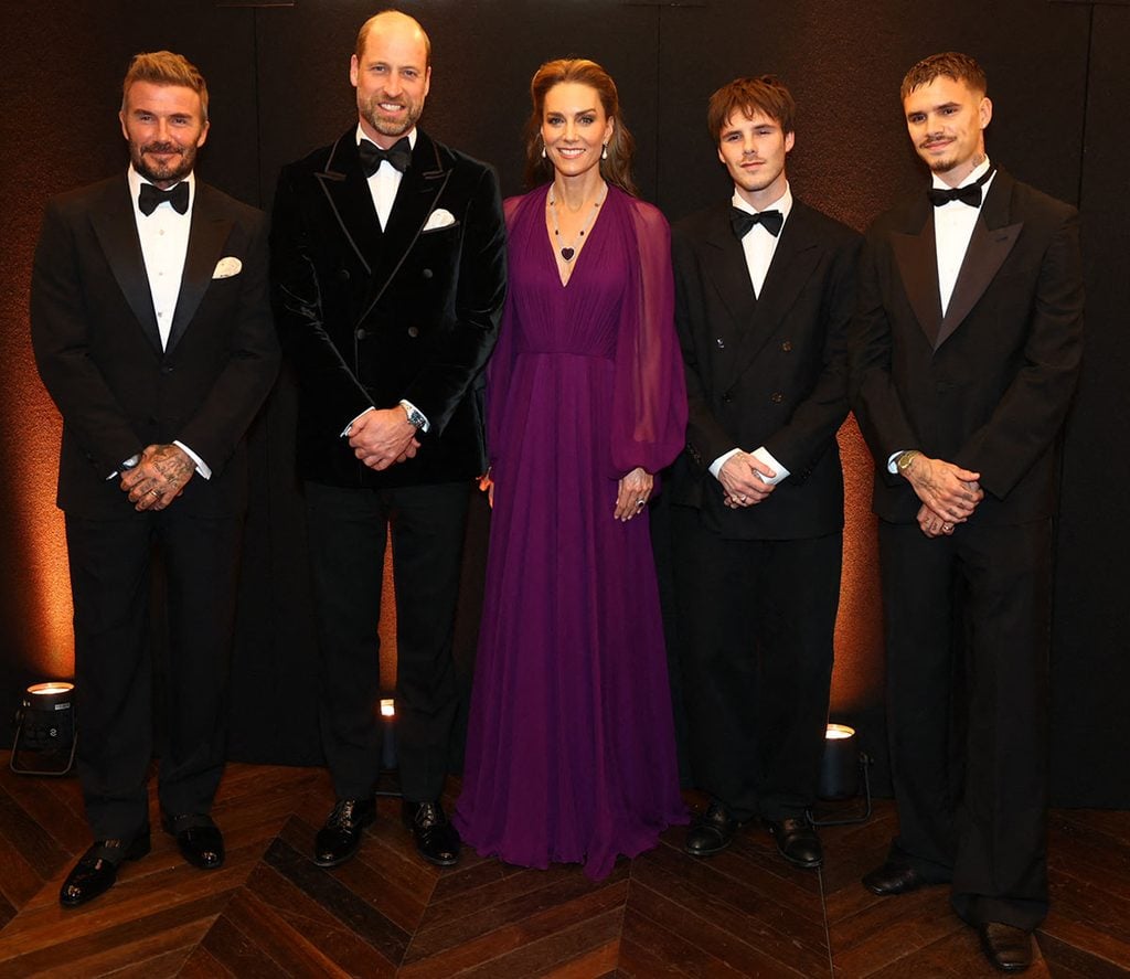 Prince William, Prince of Wales and Britain's Catherine, Princess of Wales pose for a photo with David Beckham and his sons Cruz and Romeo while attending the global premiere of the film 'Digger'