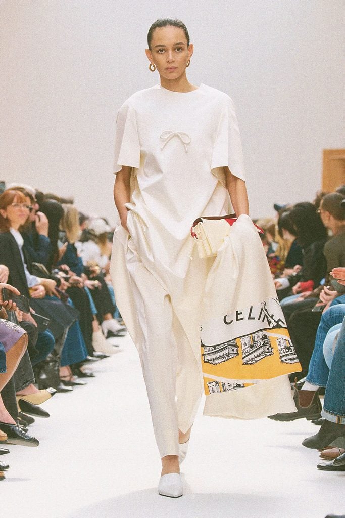 Celine Fall 2026 runway look featuring a white tunic over tailored trousers.
