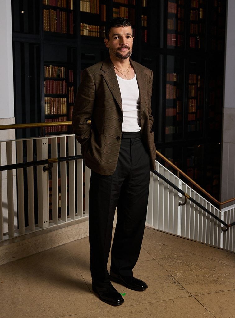 Christopher Abbott wears a Ferragamo Prince of Wales check blazer and black trousers at the ‘East of Eden’ photocall.