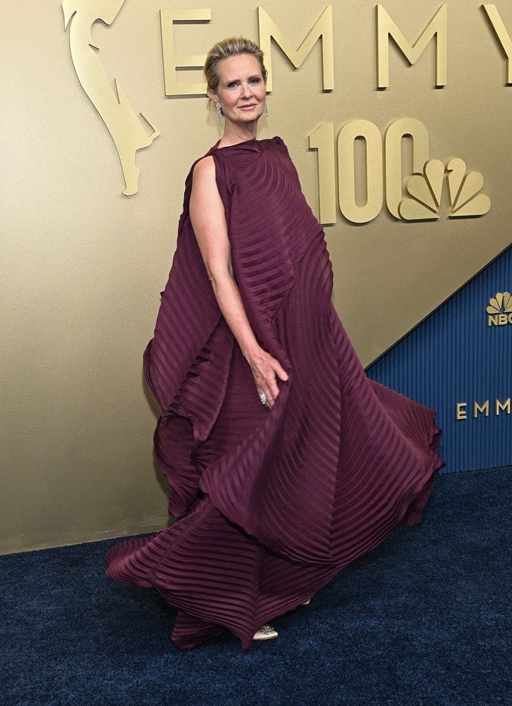 Cynthia Nixon wearing a burgundy pleated Issey Miyake dress at the 2026 Emmy Awards.