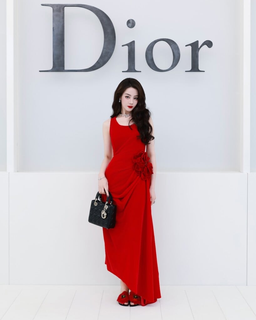Dilraba Dilmurat wearing a red Dior dress at the Dior Spring 2027 show in Paris.