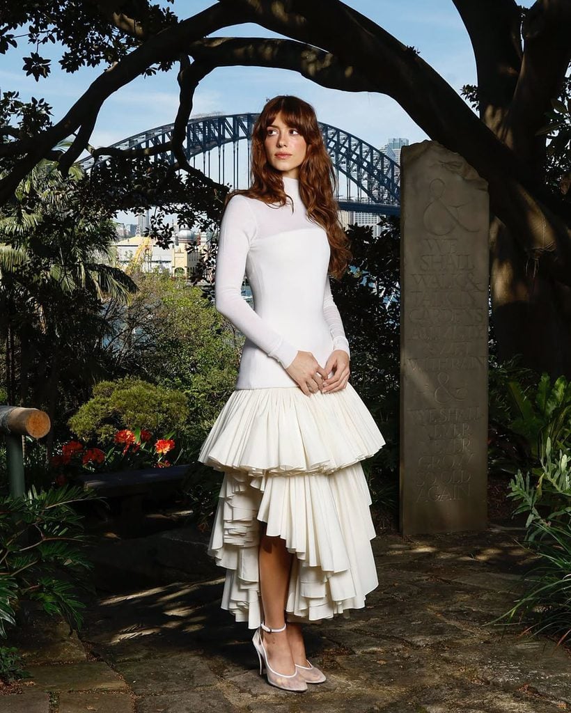 Daisy Edgar-Jones in an ivory long-sleeved Alaïa dress with an asymmetrical pleated skirt at Wendy’s Secret Garden in Sydney.