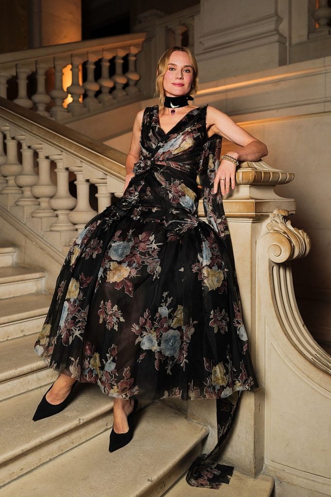 Diane Kruger seated wearing an Erdem Resort 2027 dress with Tiffany & Co. jewellery at the Jean Schlumberger dinner in Paris.