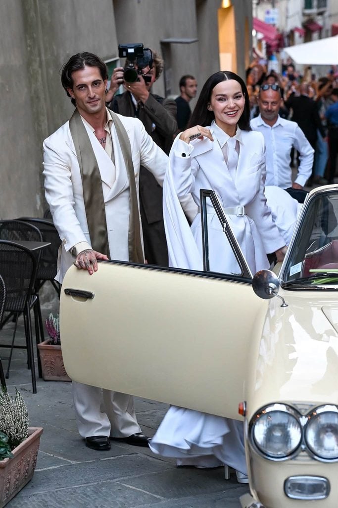 Dove Cameron in Armani Privé and Damiano David in Giuliva Heritage following their Montalcino Town Hall wedding.