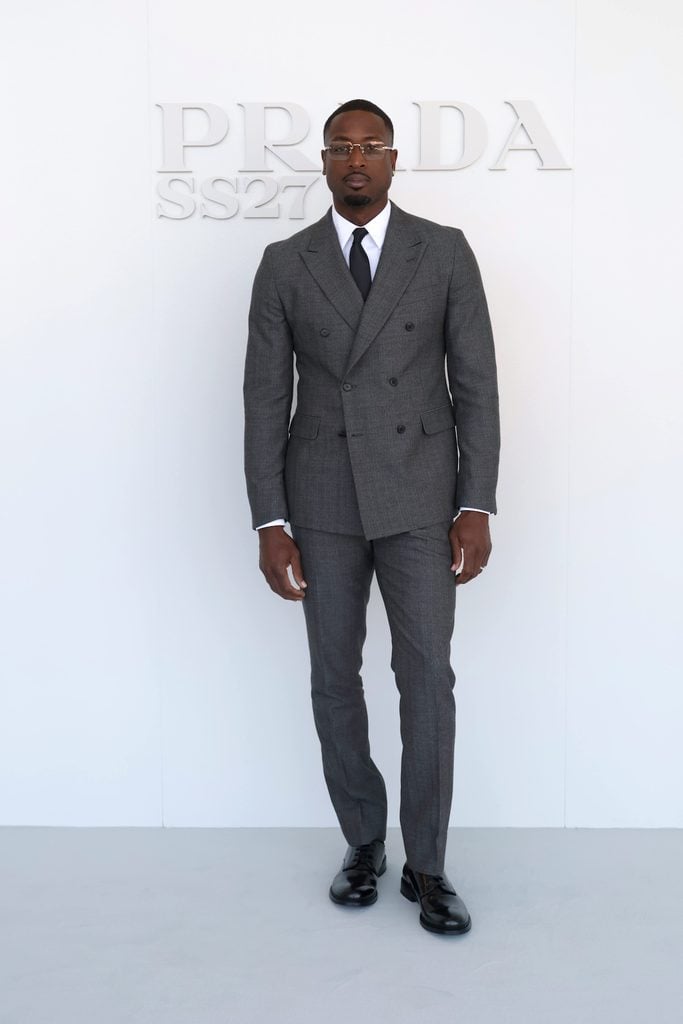 Dwyane Wade wearing a Prada suit at the Spring/Summer 2027 womenswear show in Milan.
